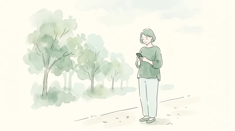 友人グループがスマホで精算を確認している