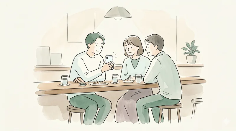 Three people at a bar counter showing a smartphone screen with bill split